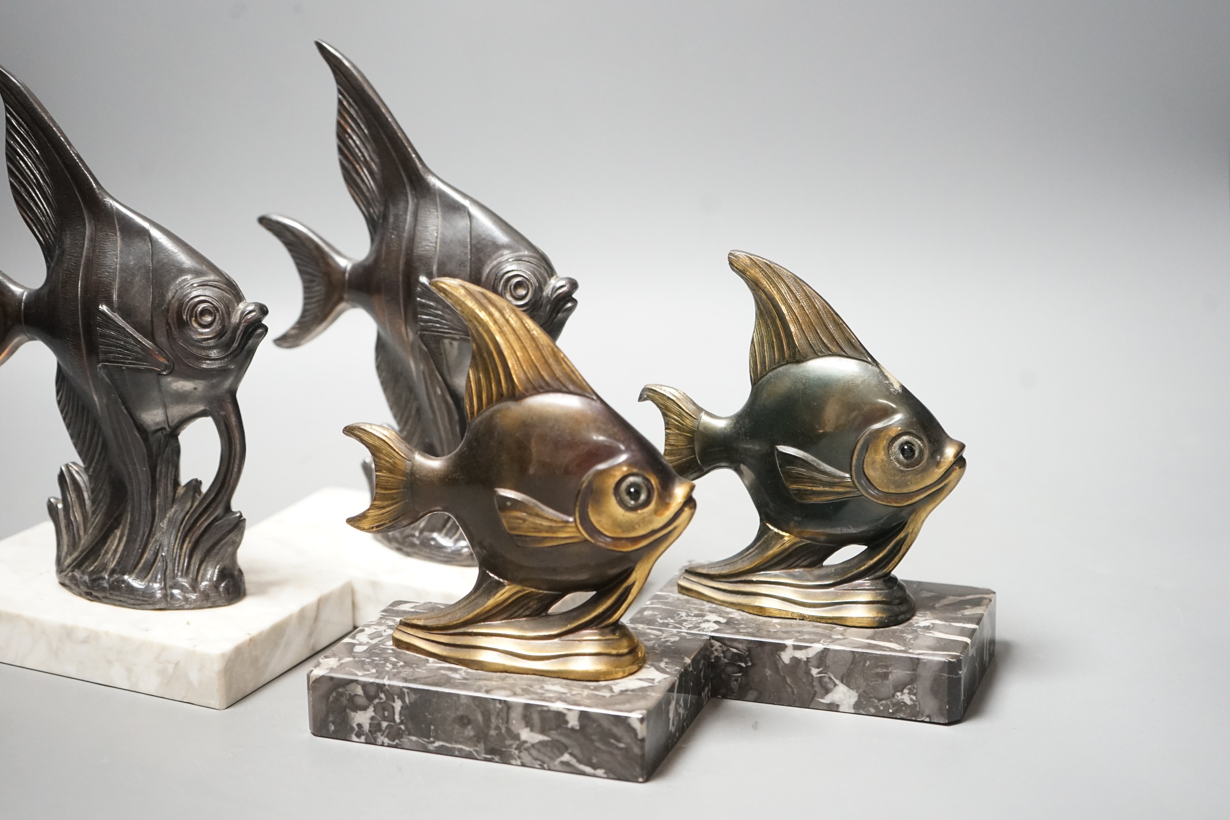 Two pairs of Art Deco spelter 'Angel fish' bookends. Tallest pair 20cm